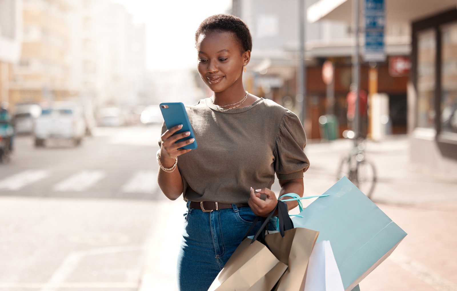 Woman staring at her phone in the streer